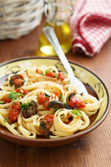Pasta with olives, parsley and tomatoes