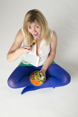Woman eating helathy food a salad take away meal