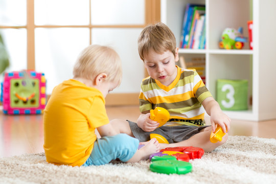 children with toys in playroom