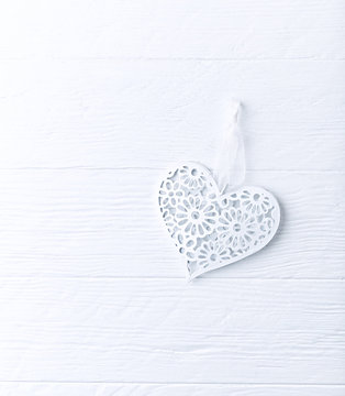 Vintage heart-shaped decoration on a wooden surface