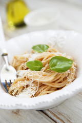 Pasta with cheese and green basil