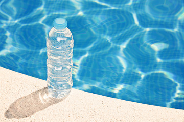 Water bottle by swimming pool