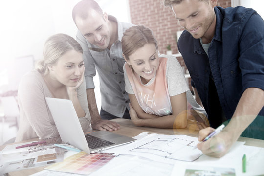 Students in architecture working together on project