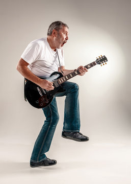 Full length portrait of a guitar player