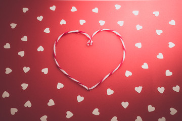 white hearts on red background