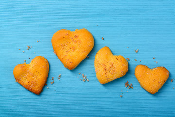 Obraz premium Heart-shaped cookies on wooden background.