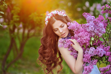 beautiful woman in the Spring Park and the setting sun