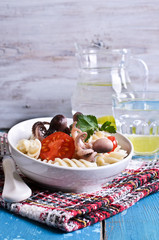 Salad with octopus, pasta and tomato