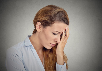 portrait of sad young woman isolated grey wall background