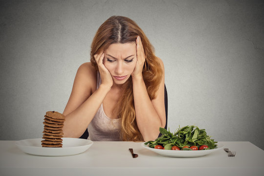 woman tired of diet restrictions deciding to eat healthy food