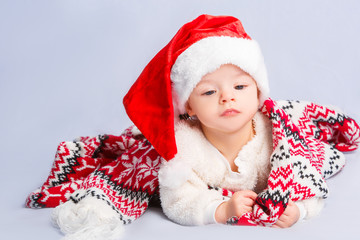 Beautiful little baby celebrates Christmas.