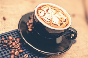 black cup of freshly brewed espresso coffee.