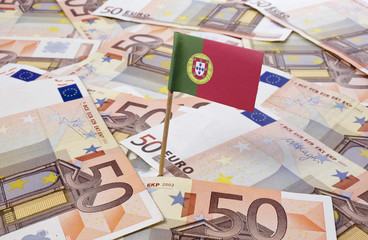 Flag of Portugal sticking in 50 Euro banknotes.(series)