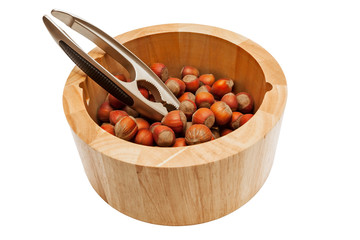 Hazelnuts in bowl isolated on white background