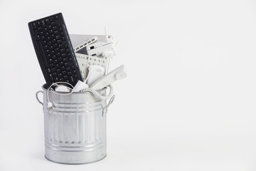 Garbage Can Filled With Obsolete Office Equipment