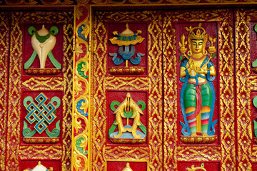 Fototapeta na wymiar Buddhist ornament colorful door near stupa Boudhanath