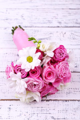 Beautiful wedding bouquet on wooden background