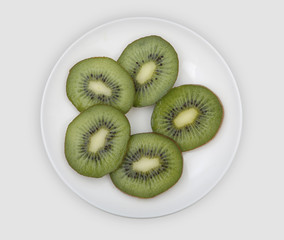sliced kiwi on a white plate