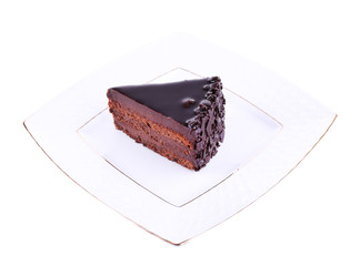 Delicious chocolate cake on plate isolated on white