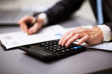 Man doing his accounting, financial adviser working