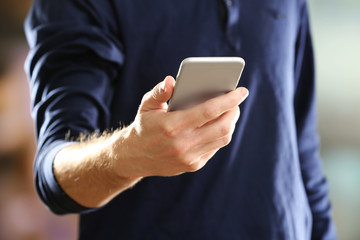 Man using mobile smart phone on bright background
