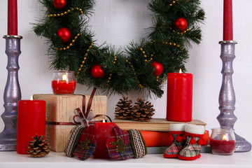 Christmas decoration with wreath, candles and present boxes