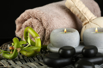 Beautiful spa composition with bamboo on dark background
