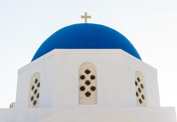 Fototapeta na wymiar Typical blue cupola of a church in Santorini