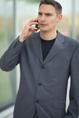 Portrait of a young businessman talking on the mobile phone