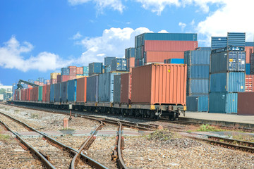 Obraz premium Cargo train platform with freight train container at depot