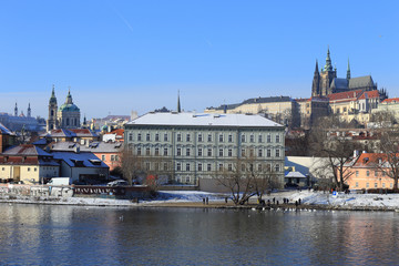 Snowy Prague gothic Castle above River Vltava, Czech Republic