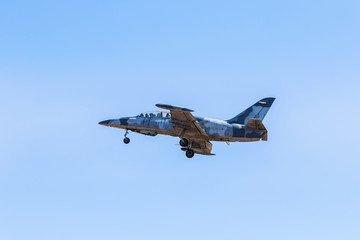 L-39 albatros fighter jet flying on blue sky background