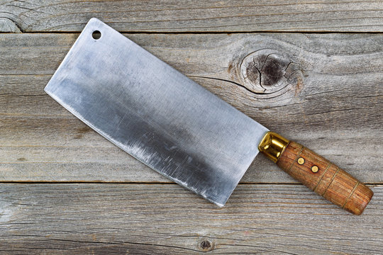 Vintage butcher Knife on aged wood