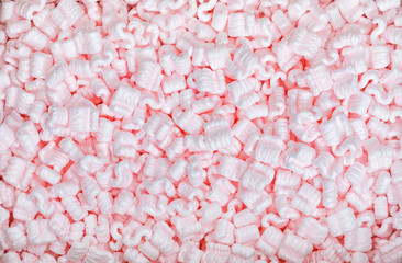Pink packaging peanuts background