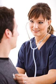Doctors: Nurse Listens to Patient Heart
