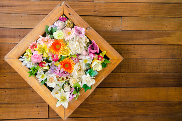 colorful flower on wooden background