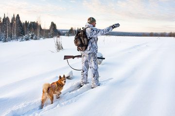 hunter on the snowy road