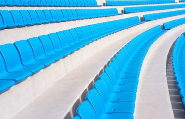 Naklejka premium Rows of empty blue stadium seats