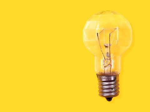 Lightbuld isolated on yellow background