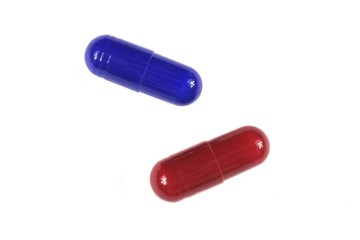 Blue and red pills isolated on white
