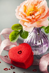 Heart shaped gift box and rose in vase, Valentine's Day concept