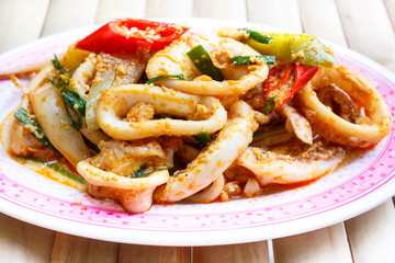 Fried squid in yellow curry powder.