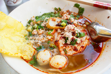 Spicy lemongrass flavored flat noodles with pork.