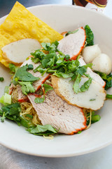 Wheat noodles with vegetables and meat.