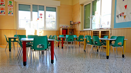 interiors of a kindergarten class with the chairs and children's - obrazy, fototapety, plakaty