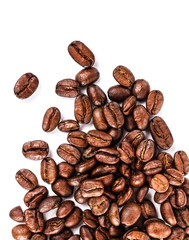 Brown coffee beans isolated on white background macro. Roasted C