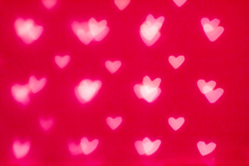 Abstract Valentine's day background with red hearts. Glow Colorf