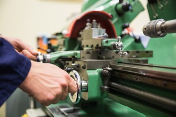 Engineering student using heavy machinery