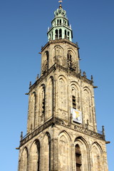 Martini tower from 1482 against a blue sky in Groningen