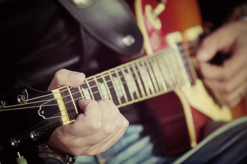 Fototapeta na wymiar guitar player in vintage tone